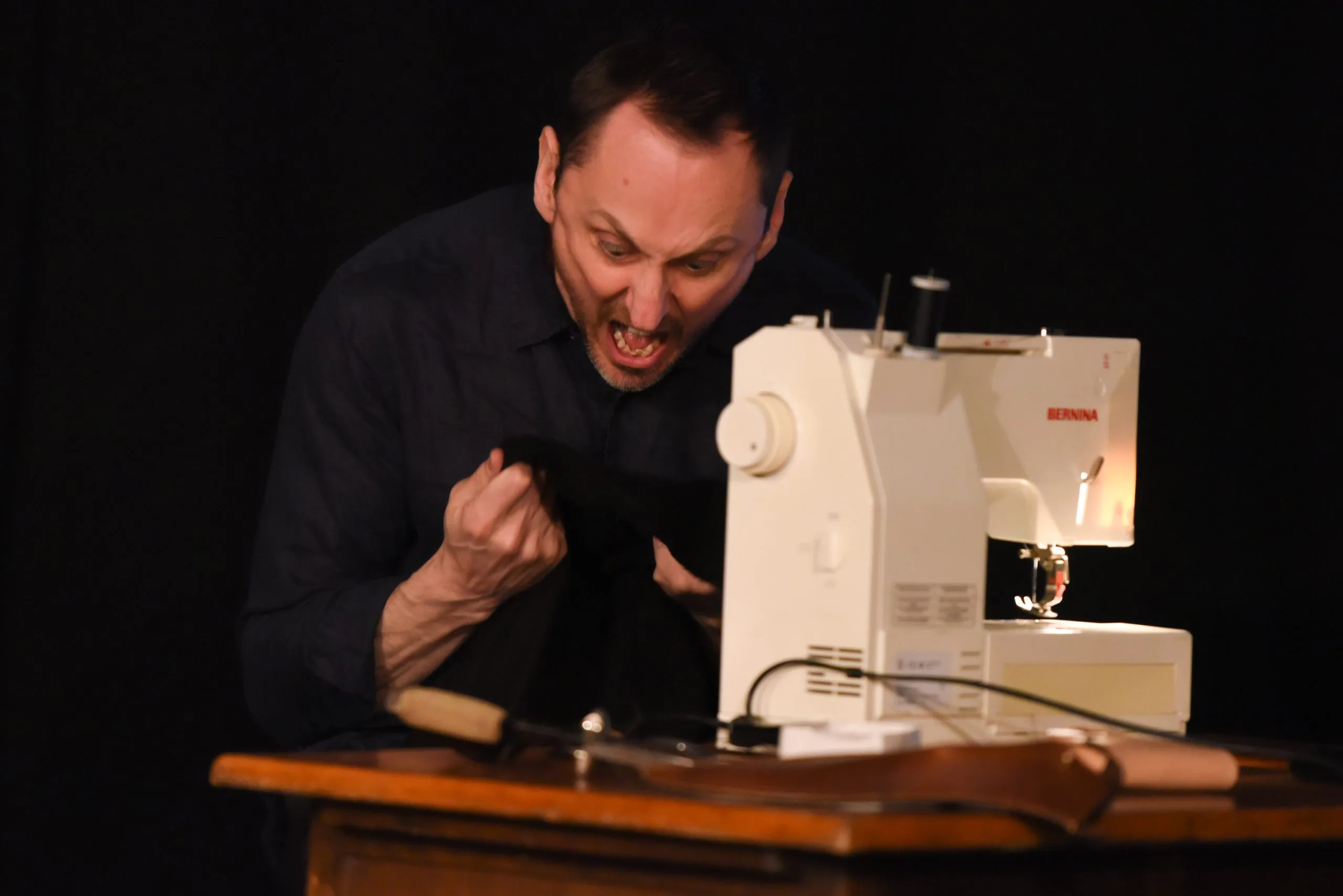 Square-Peg-1-scaled-1 Angry man at sewing machine